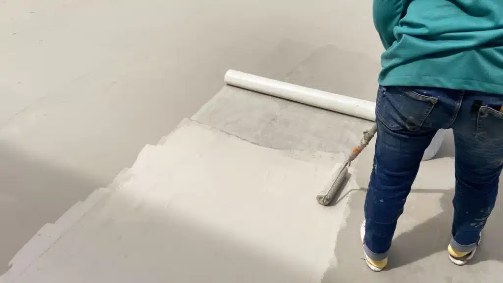 roofer applying sealant