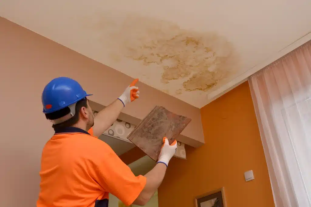 roofer looking at water stain