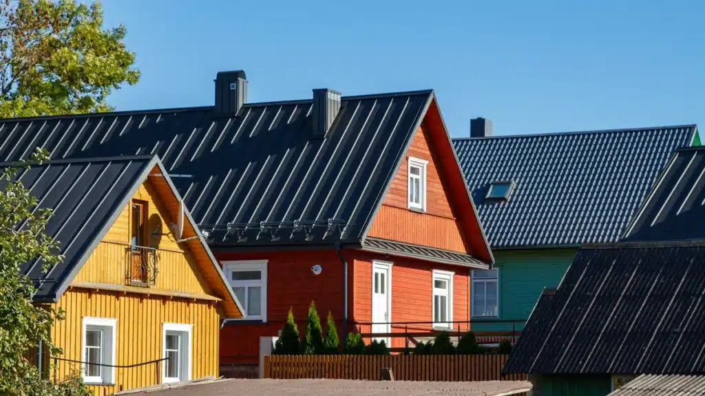 colored houses with black metal roof
