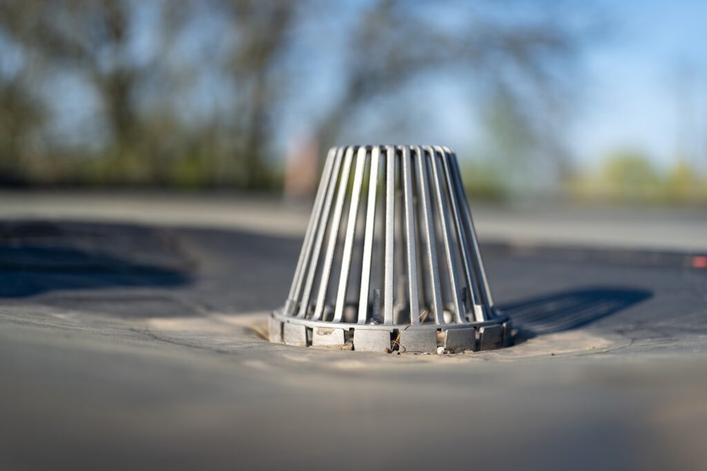closeup of flat roof drain