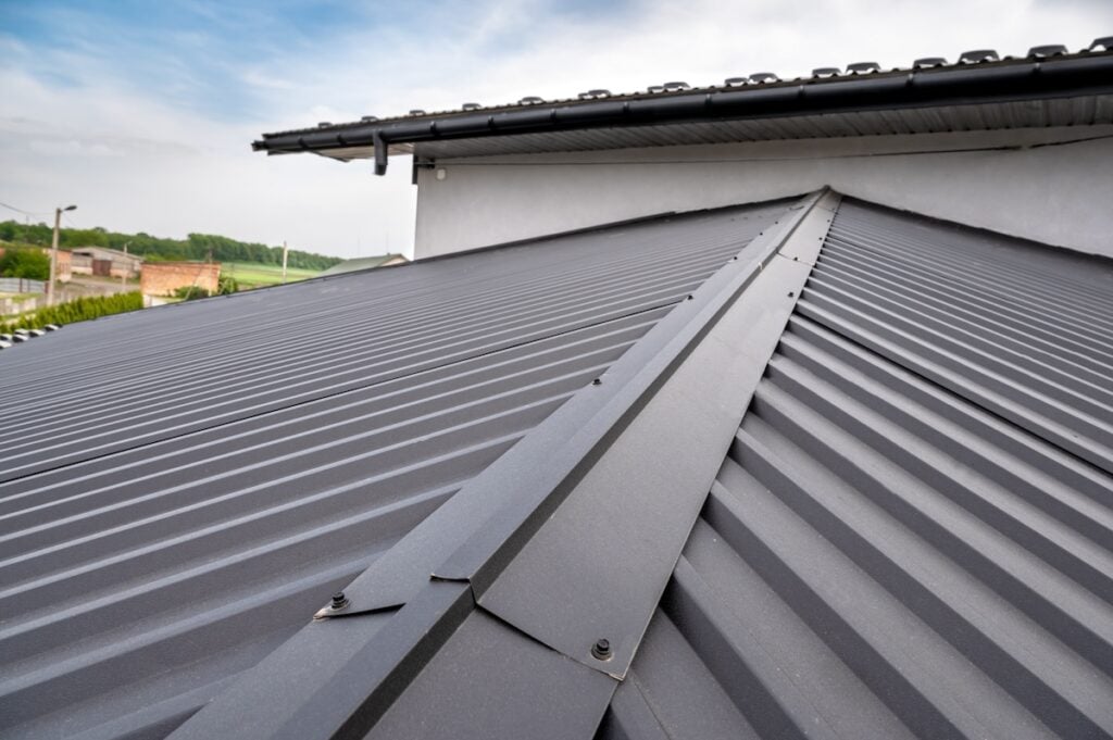 closeup metal seam roof installation