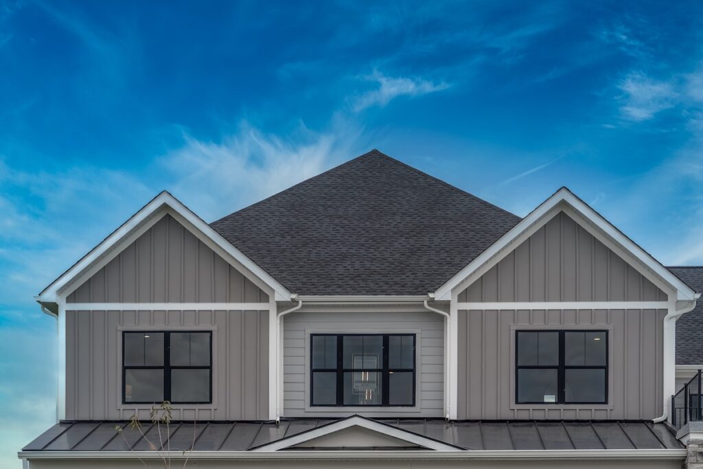 gray residential house with metal roof trim
