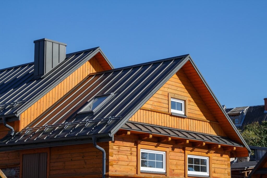 wood siding house with metal seam roof
