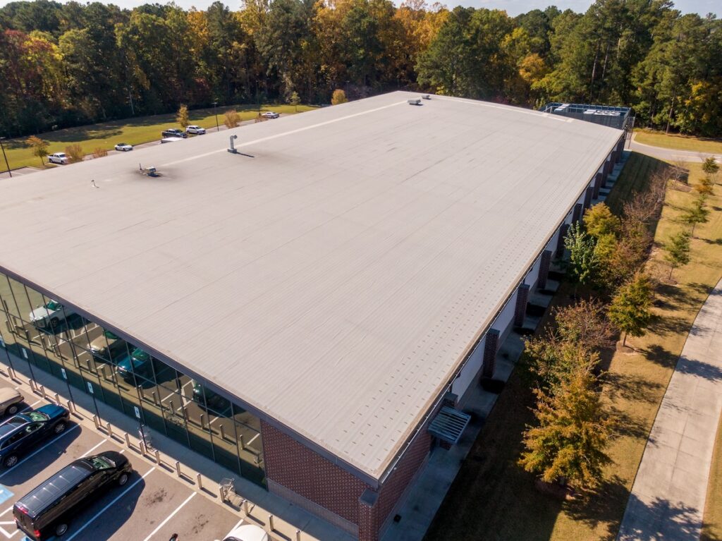 large commercial building white tpo roofing