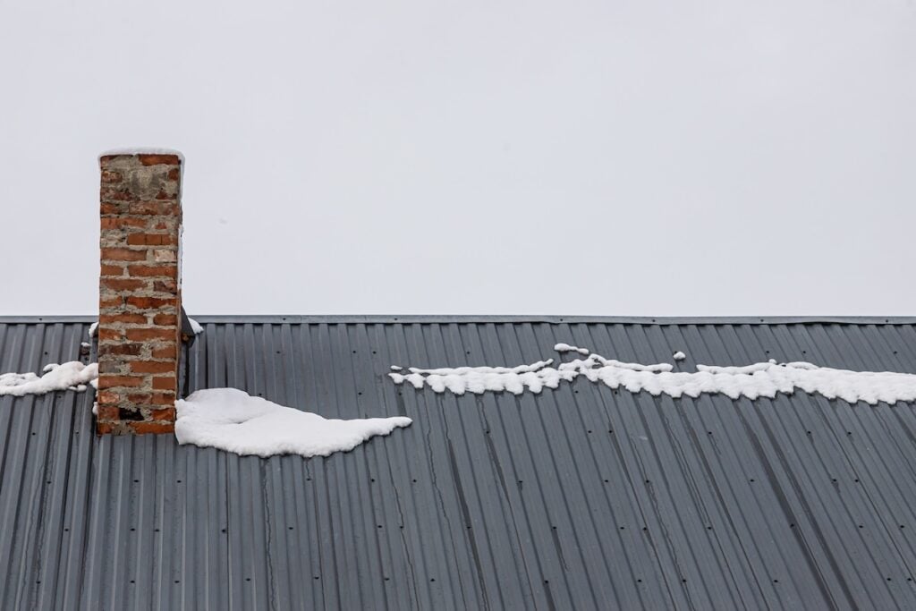 brick chimney metal panel roof