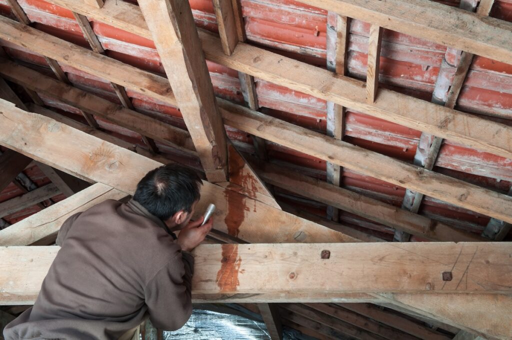 water leaking in attic beams