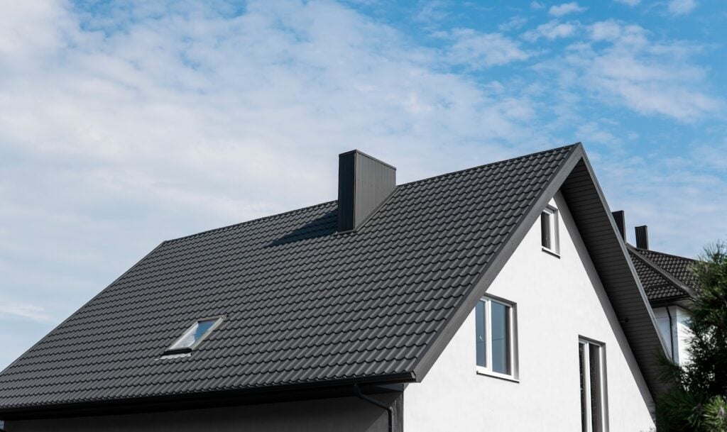 Modern roof covered with tile effect metal roof sheets