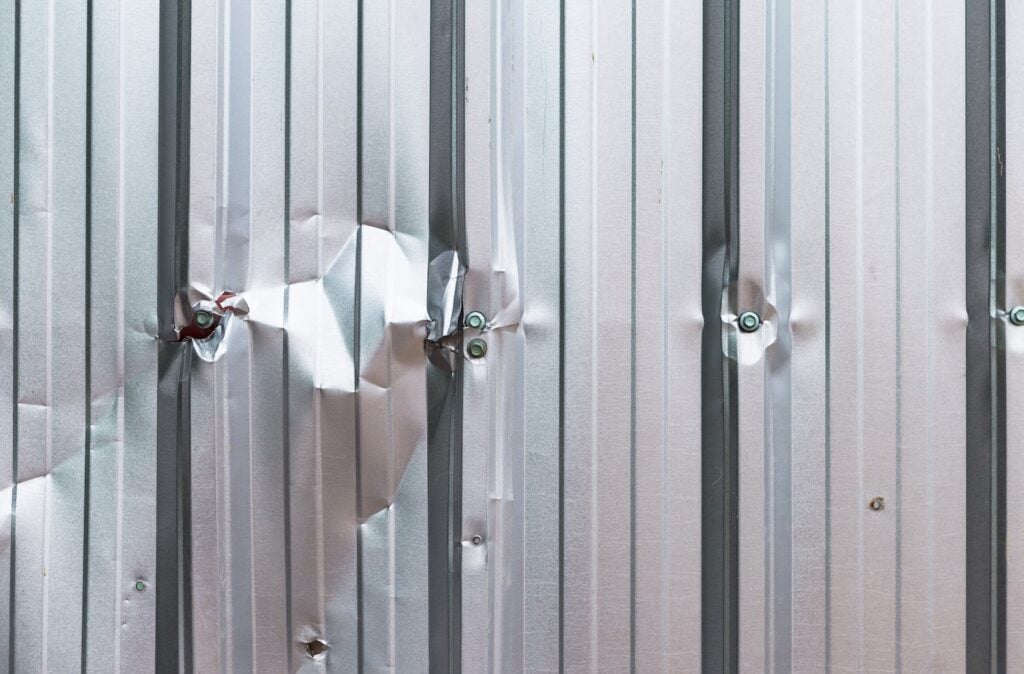 Damaged metal sheet wall background, construction concept background
