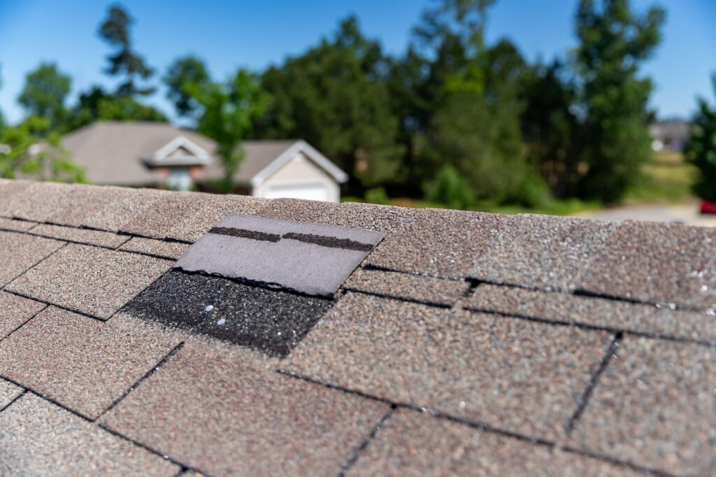 Roofing shingle damaged dueing windy storm.